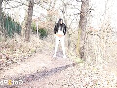 Dark Haired Babe Pisses On The Path