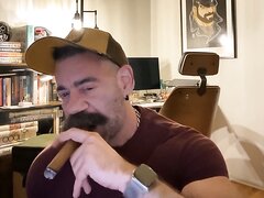 Stached Stud Working A Cigar