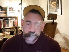 Stached Stud Working A Cigar